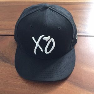 The Weeknd New Era XO strap-back flat bill hat.